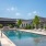 Resort-style swimming pool with lounge seating