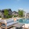 Resort-style swimming pool with lounge seating